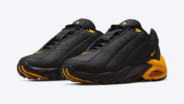 View of black and gold NOCTA shoes.
